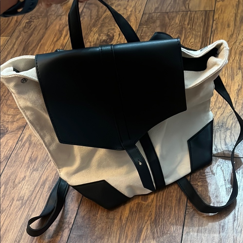 Deux Lux Black and Cream Backpack with Flap-Top Design